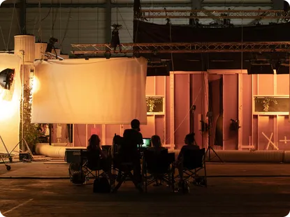 Wide shot of the film crew, lighting rig, and soundstage during production of Pura's fragrance campaign film.